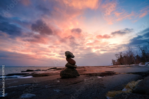 Obraz Zen Stone Stacking on rocks during sunset