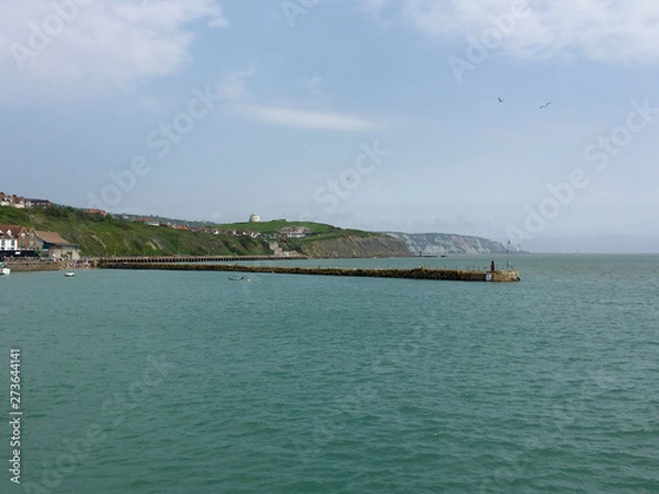 Fototapeta Harbour arm and cliffs in Folkstone, Kent, UK