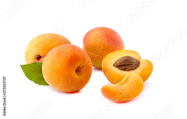 Fototapeta Apricots with leaf on white background closeup