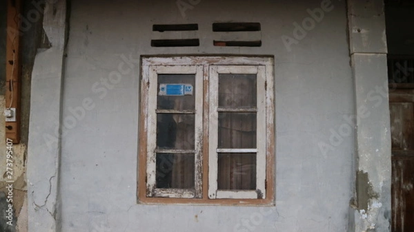 Fototapeta Old Window Frame on the crack grey wall