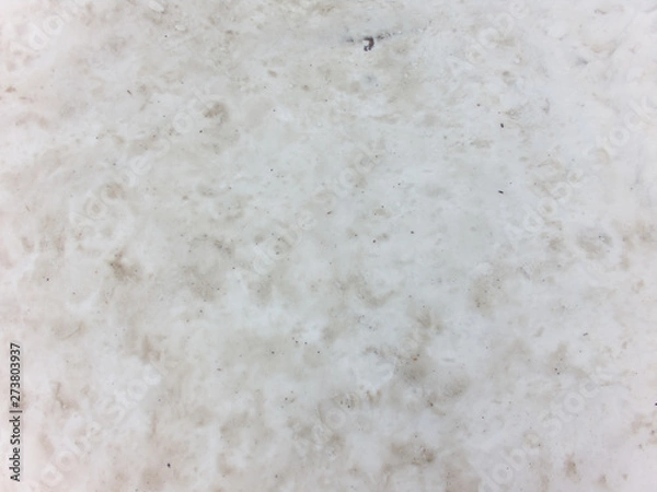 Fototapeta Dirty melting snow background. Top view