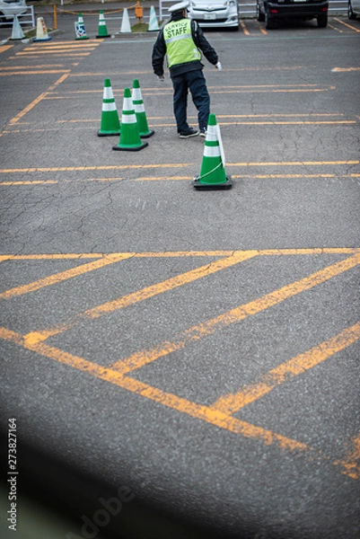 Obraz Bus parking lot in an outlet shopping arcade, green cones with yellow traffic lines as guided with a staff to control the flow.