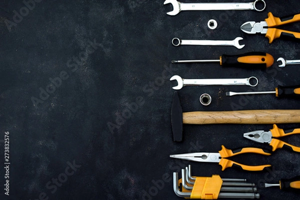 Fototapeta construction tools in wooden box in black background