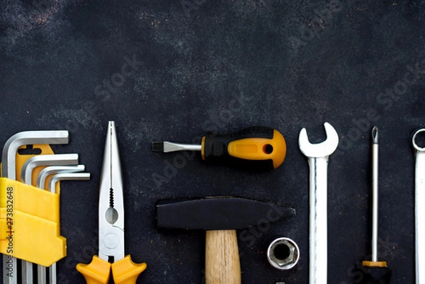 Fototapeta construction tools in wooden box in black background