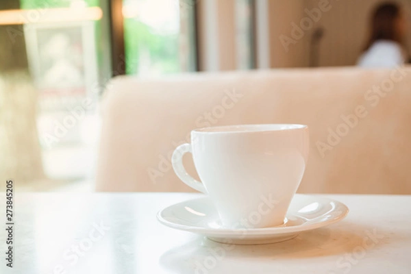 Fototapeta Cup on the table in cafe