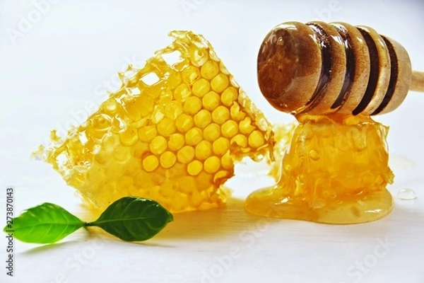Fototapeta Honey comd slice isolated on the white background