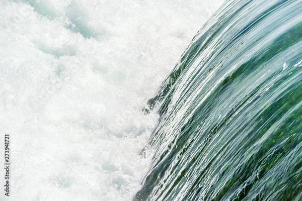 Obraz Smooth water falling into churning rapids.