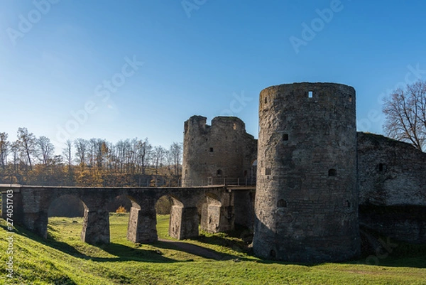 Obraz medieval fortress in Koporye, side view backlight