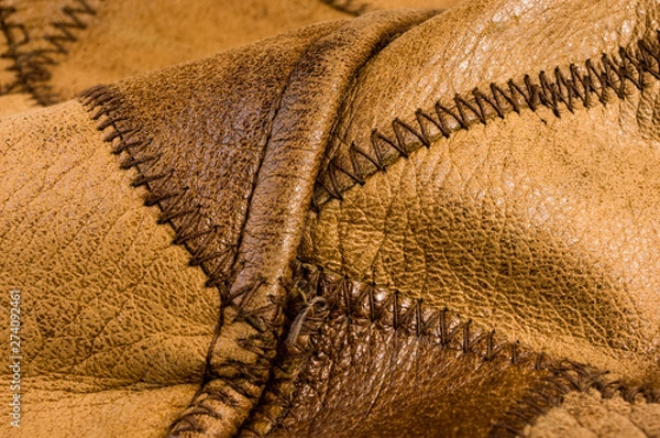 Fototapeta Old vintage genuine soft brown leather texture background, top layer with pores and scratches, macro, close-up
