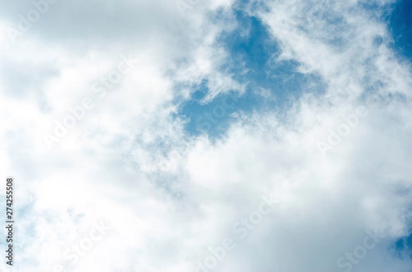 Fototapeta Blue sky and white clouds with blurred background patterns