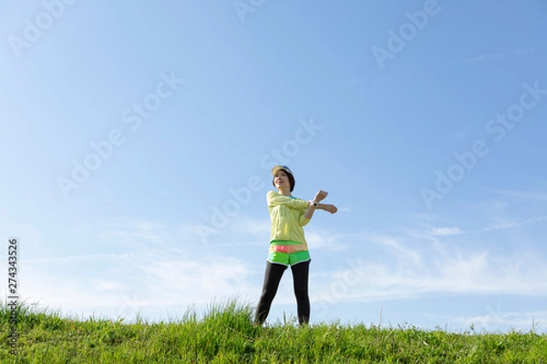 Fototapeta ストレッチをする女性