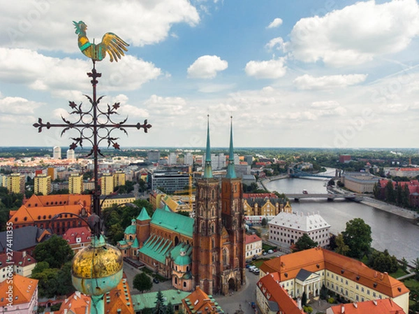 Fototapeta The weathercock of Collegiate Church of the Holy Cross and St. Bartholomew,  aerial view of Wroclaw: Ostrow Tumski, Cathedral of St. John the Baptist 