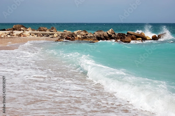 Fototapeta Landscape with waves and turquoise sea on the beach of the Romanian resort.