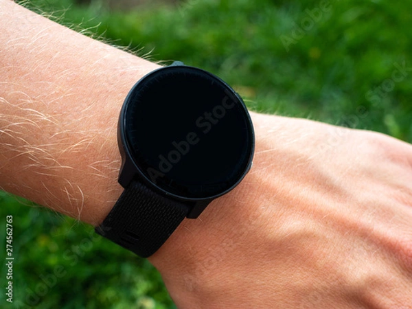 Fototapeta Smart watch with blank face on mans wrist