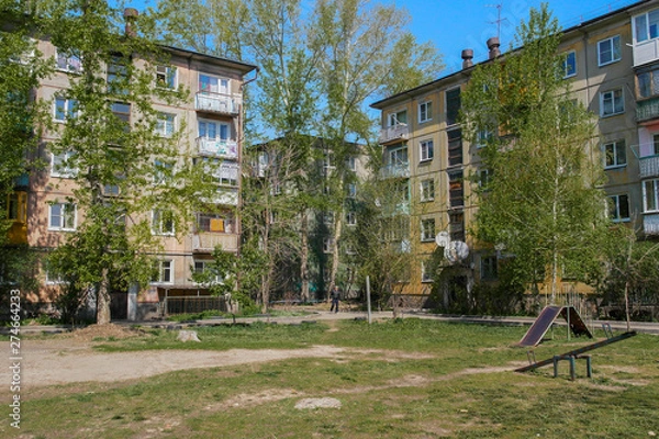 Fototapeta Soviet architecture. Ust-Kamenogorsk (Kazakhstan) Apartment buildings. Soviet architectural style. Residential buildings. Soviet built multistory apartment buildings. Old residential area