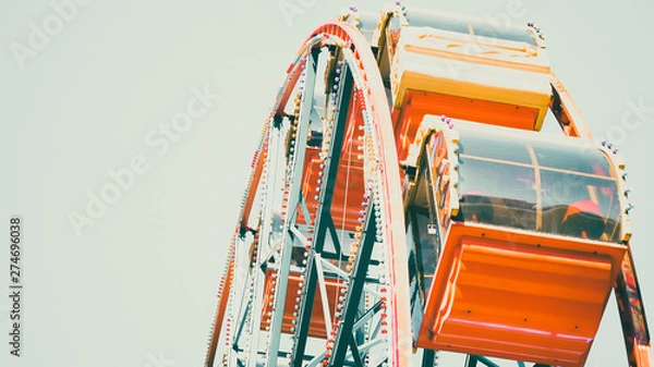 Obraz Old carousel, ferris wheel in an amusement park