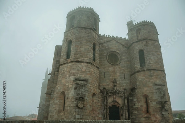 Fototapeta Gothic Cathedral with steeples in the morning mist