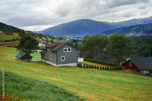 Obraz little country is situated among spellbinding landscape of Norwegian nature with high charming mountains and hills