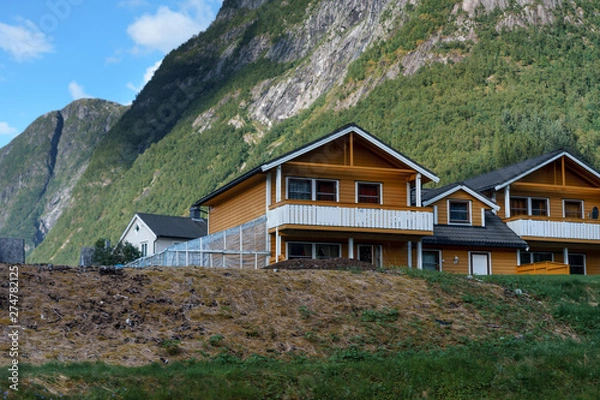 Obraz little country is situated among spellbinding landscape of Norwegian nature with high charming mountains and hills