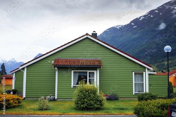 Obraz little country is situated among spellbinding landscape of Norwegian nature with high charming mountains and hills