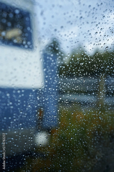 Obraz spellbinding landscape of Norwegian nature with high charming mountains and hills, wonderful rivers imprinted on photos of traveler throw window with rain drops