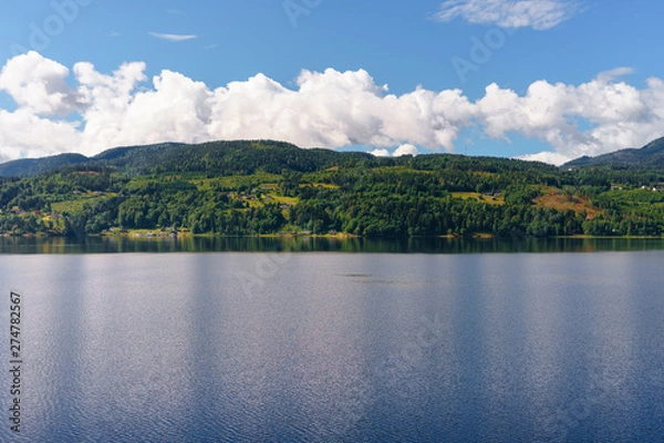 Obraz spellbinding landscape of Norwegian nature with high charming mountains and hills, wonderful rivers in which it is impossible not to fall in love