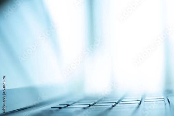Obraz Close up Laptop keyboard. Selective and soft focus. Subject is blurred. blue theme