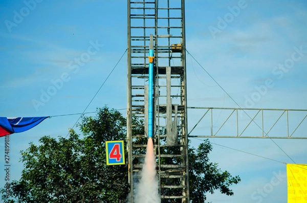 Obraz Roi-et,THALAND-JULY 18 : People in country side watch traditional rockets in Rocket festival 'Boon Bang Fai' The celebration for plentiful rains during rice plant season on July 18,2019 Phanomphai.