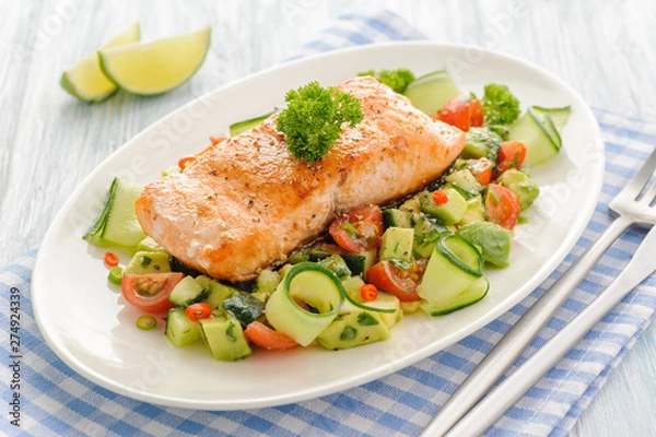 Fototapeta Grilled salmon fillet with vegetable salad.