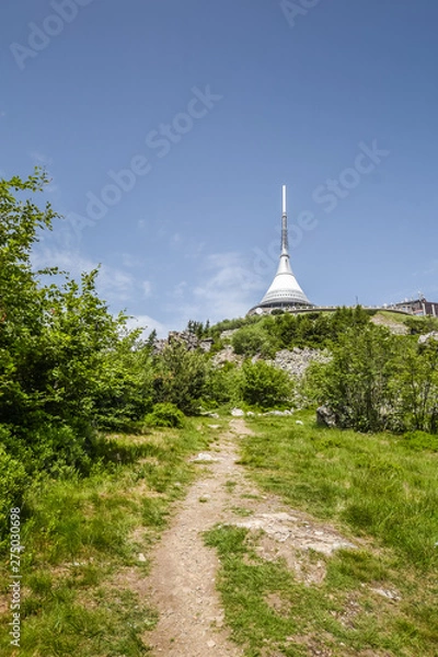 Fototapeta Road to transmitter on mountain top. Summer weather.