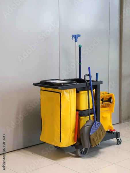Fototapeta Closeup of janitorial, cleaning equipment and tools for floor cleaning. Vertical view.