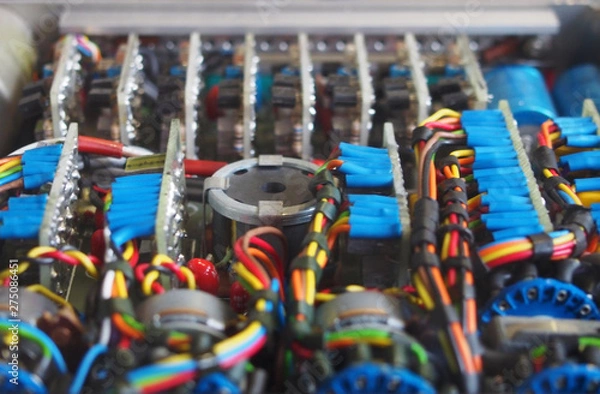 Fototapeta selective focus image of complex colored wiring and connectors joining circuit boards with electrical components