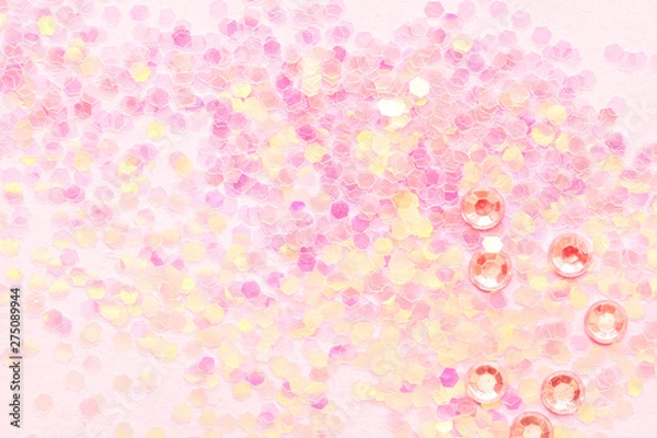 Fototapeta Confetti on pink paper background, festive concept.