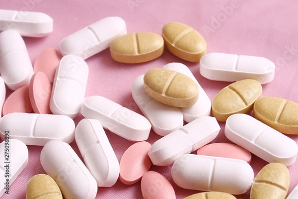 Fototapeta Different pills on the pink background