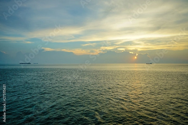 Obraz The Sun is falling on the sea at Hellfire Pass of Koh Si Chang, Chon Buri, Thailand.
