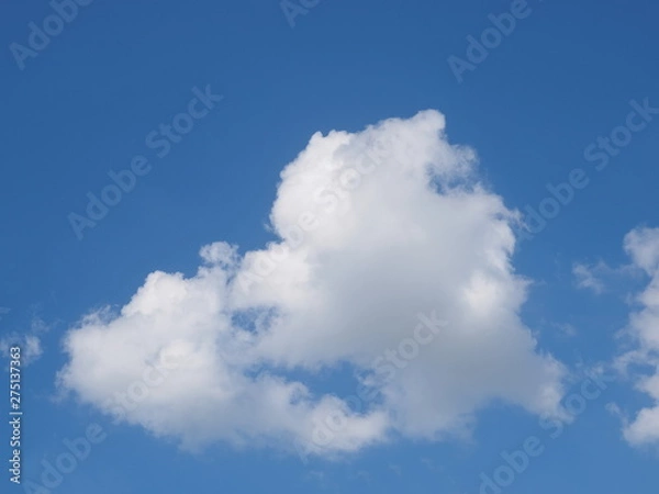 Obraz Cloudy sky background, view of fat white clouds moving in blue sky background.