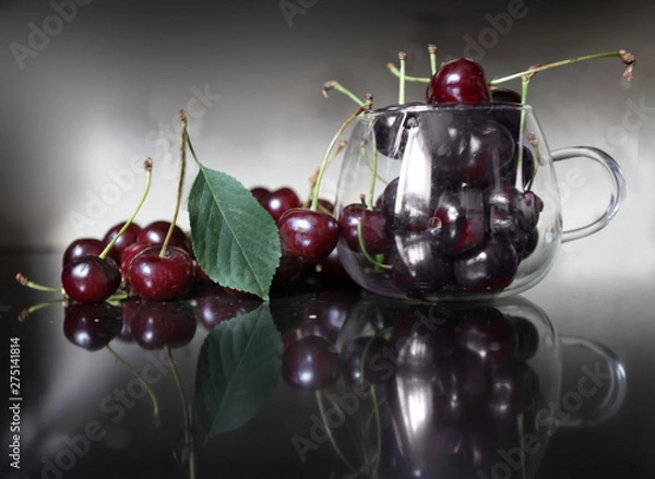 Fototapeta Red ripe cherry lying on the table