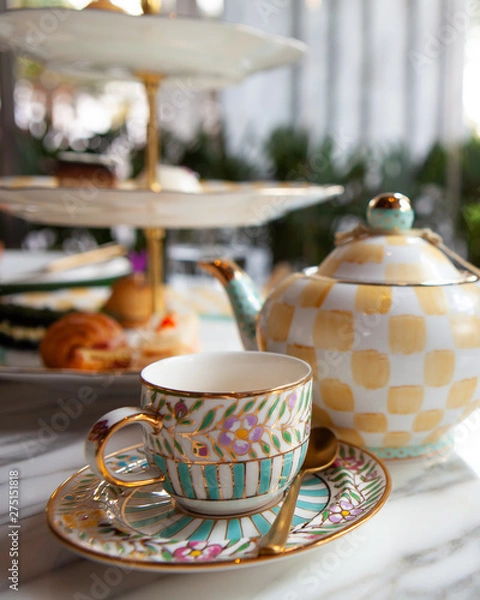 Fototapeta Magical and colorful set of afternoon tea in Alice in Wonderland theme. Tasty and delicious dessert, savories, bakery and pastry. Good for high tea party or Birthday celebration. Natural light.