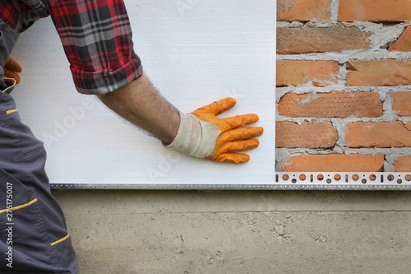 Obraz House renovation, polystyrene wall insulation, plate placing
