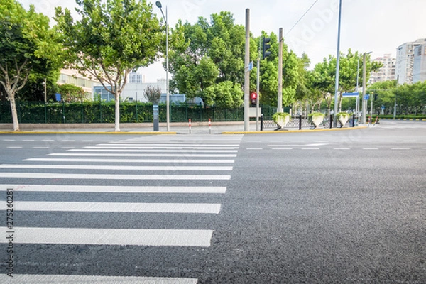 Fototapeta Zebra traffic walk way in the city