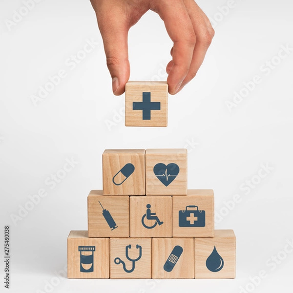 Fototapeta Concept of Insurance for your health, Hand hold wooden block with icon healthcare medical