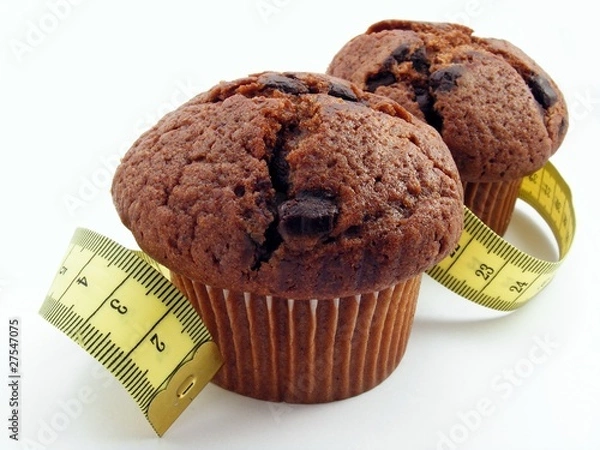 Fototapeta 2 chocolate muffins with measuring tape