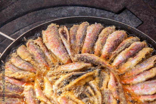 Obraz Fresh striped red mullets frying