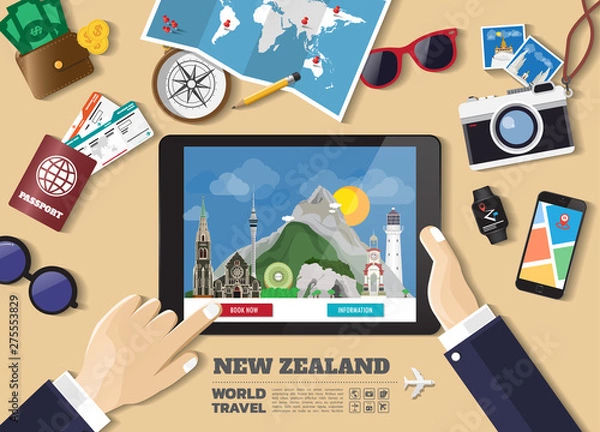 Fototapeta Hand holding smart tablet booking travel destination.New zealand famous places.Vector concept banners in flat style with the set of traveling objects, accessories and tourism icon.