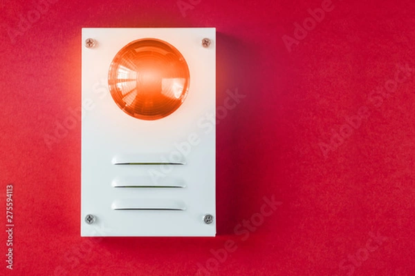 Fototapeta Fire safety system on a red background of a copy space