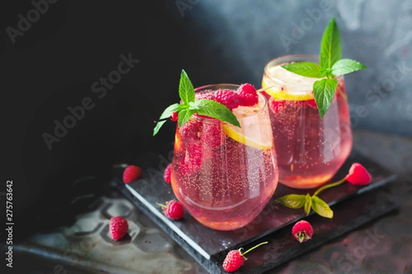 Fototapeta Sparkling pink raspberry lemonade on grey background