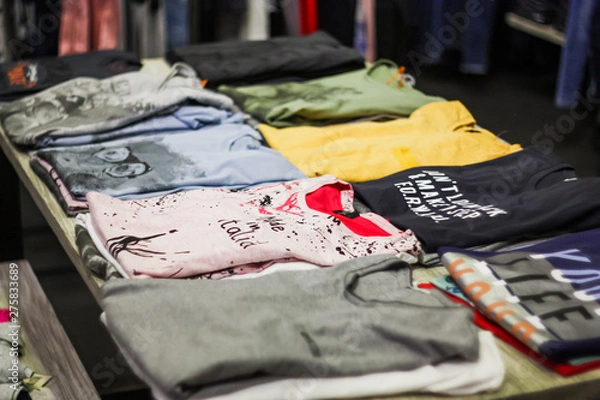 Fototapeta different women's shirts sold in a clothing store