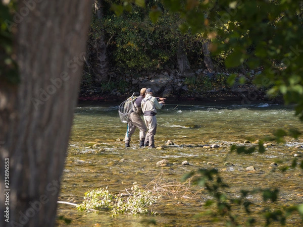Fototapeta Two fishermen in a Pyrenees river