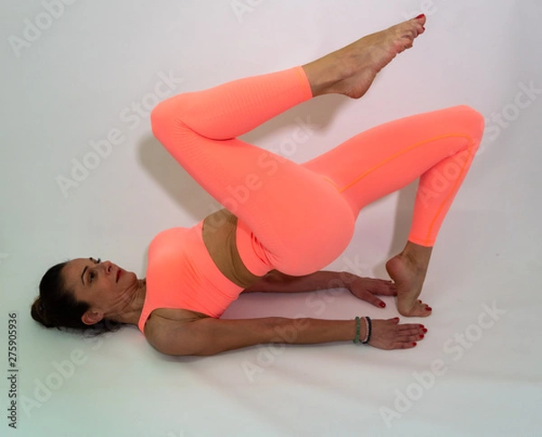 Obraz A middle age woman is doing yoga