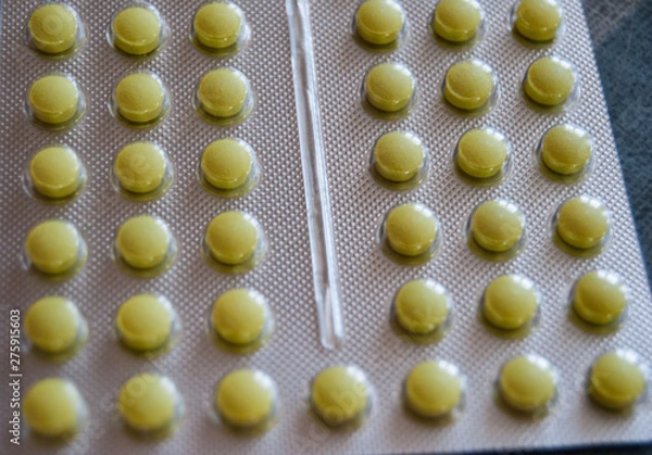 Obraz small yellow pills tablets blaster